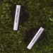Bang & Olufsen Beo Grace true wireless-ørepropper i premiumdesign på græsplæne.